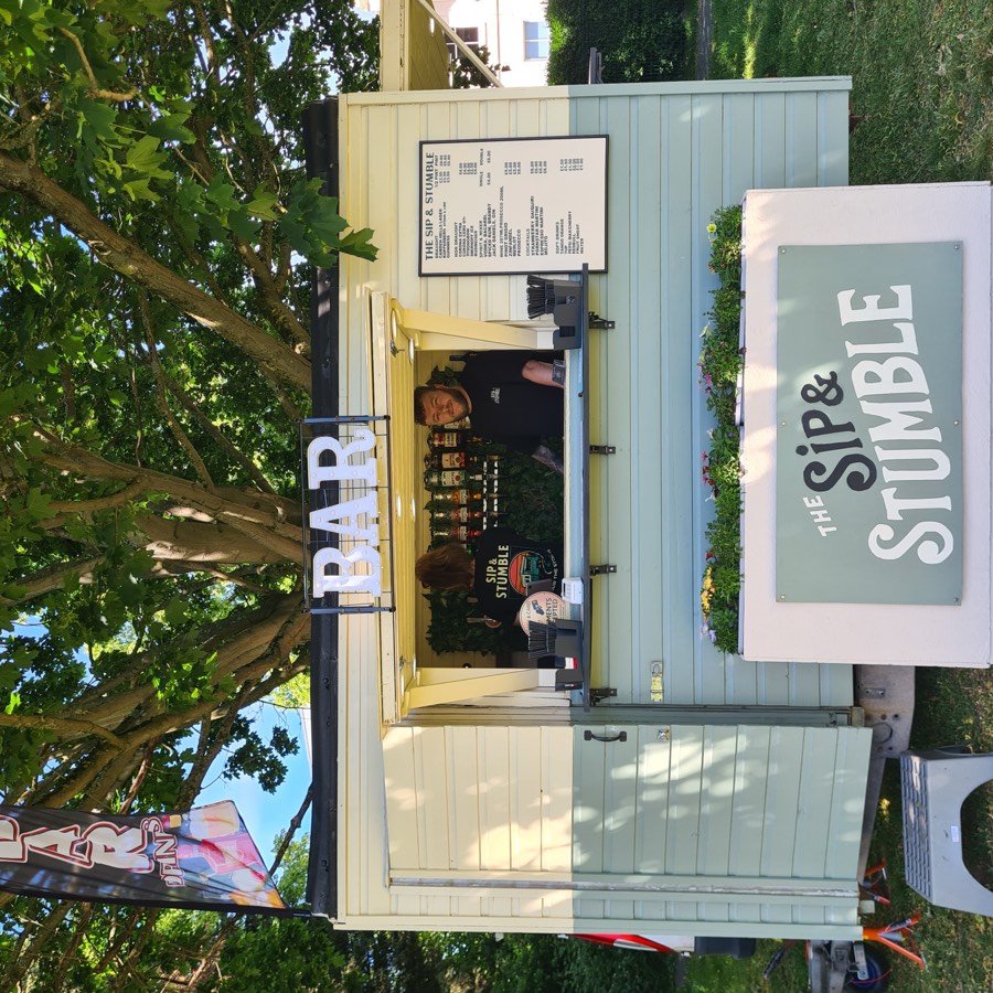 Sip & Stumble staff serving drinks at an event